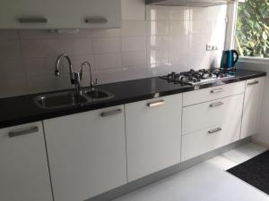 A kitchen or kitchenette at Cozy room in residential Alkmaar