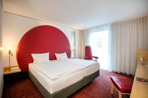 ARCOTEL Rubin Hamburg客房内的一张或多张床位
