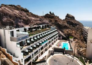 a hotel on a cliff next to the ocean at IG Nachosol Atlantic & Yaizasol by Servatur - Adults Only in Puerto Rico de Gran Canaria