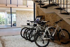 a group of bikes parked next to a staircase at Hotel de Montaña La Rocha in Quesa