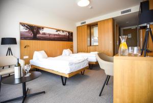 Postel nebo postele na pokoji v ubytování Hotel S-PORT Véska
