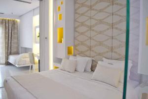 Postel nebo postele na pokoji v ubytování Aegialis Hotel & Spa