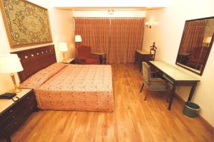 Dayrell Hotel e Centro de Convenções客房内的一张或多张床位