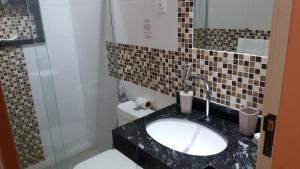 Um banheiro em Pousada Casablanca