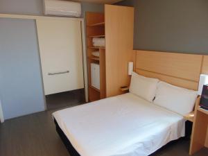 Postel nebo postele na pokoji v ubytování ibis Arapiraca