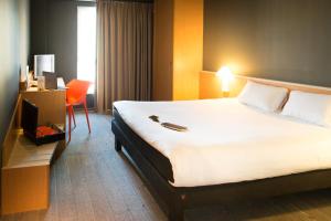 Кровать или кровати в номере Hotel Ibis Firenze Nord Aeroporto