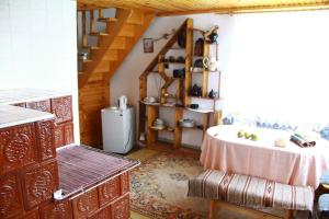 a kitchen with a sink and a refrigerator at у андрія in Yaremche
