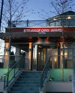 a starford arms hotel with stairs in front of it at Strangford Arms Hotel in Newtownards