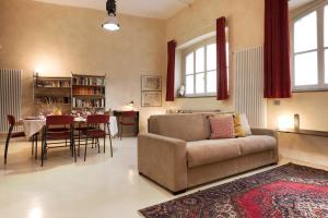 a living room with a couch and a table at Luxury Apartment Fioravanti in Milan