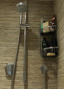 a bathroom with a towel rack and a shower at One Pelham Grove Bed & Breakfast in Stocking Pelham