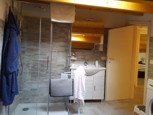 a bathroom with a shower and a sink at La Mansarda Iblea in Palazzolo Acreide