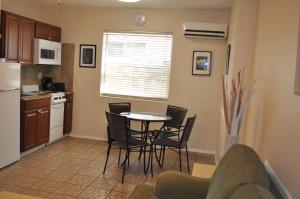 a kitchen with a table and chairs in a room at Best Florida Resort in Fort Lauderdale