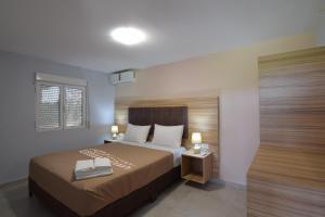 Un pat sau paturi într-o cameră la Ktima Βilioni