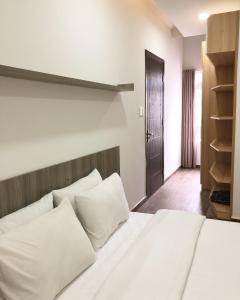 Postel nebo postele na pokoji v ubytování Street View Hotel & Apartment