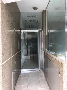 an entrance to a building with a revolving door at Departamento Ludmila in Villa María