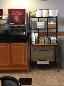 a food cart with plates and dishes on it at Wingate by Wyndham - York in York