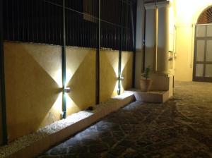 a hallway with lights on the side of a building at Terrazze Bella Epoque in Acireale