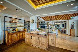 a kitchen with wooden cabinets and a counter top at Landgasthof Wurm in Bogen