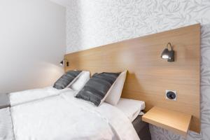 Ένα ή περισσότερα κρεβάτια σε δωμάτιο στο Hotel Spekeröd