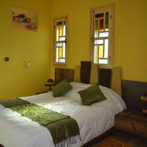 Voodi või voodid majutusasutuse Maison d'hôtes Tinwitchi toas