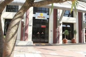 a building with a sign on the front of it at Travel Inn Live & Lodge Ibirapuera Flat Hotel in Sao Paulo