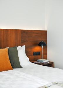 Ένα ή περισσότερα κρεβάτια σε δωμάτιο στο Umi Hotel