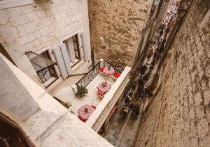 an overhead view of a table and chairs in a building at Heritage Hotel Cardo in Split
