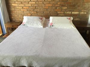 Ένα ή περισσότερα κρεβάτια σε δωμάτιο στο Viva Chico Rei Hostel