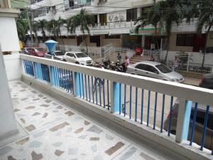 a view of a city street with cars and a fence at Karey 102 in Santa Marta