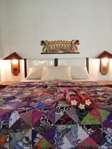 Un pat sau paturi într-o cameră la Rini hotel