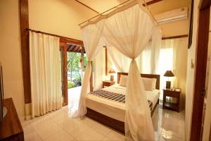 Cama o camas de una habitación en Bali Dream Resort Ubud