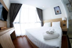 Postel nebo postele na pokoji v ubytování LiLy Apartment