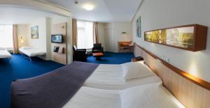 Een bed of bedden in een kamer bij Hotel Princenhof