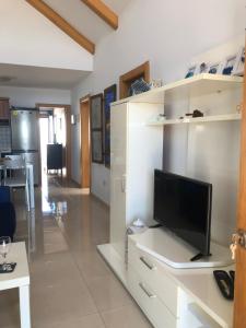 Televízia a/alebo spoločenská miestnosť v ubytovaní Casita Lanzaocean view