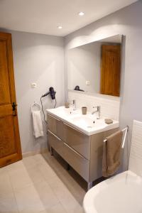 a bathroom with a sink and a mirror at Maison en Ardeche in Usclades
