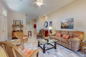 a living room with a couch and chairs and a table at Lovely La Quinta Permit# 66318 in La Quinta