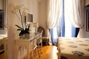 Posteľ alebo postele v izbe v ubytovaní B&B Orsini 46
