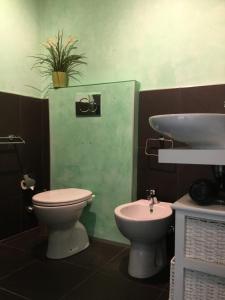 a bathroom with a toilet and a sink at Elite 19 in La Spezia