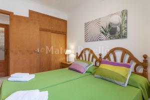 Postel nebo postele na pokoji v ubytování Apartamentos Obelisc