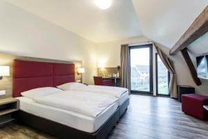 Postel nebo postele na pokoji v ubytování Hotel Holzscheiter