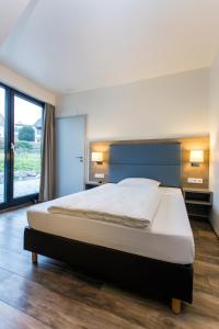 Postel nebo postele na pokoji v ubytování Hotel Holzscheiter