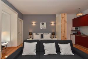 a bedroom with a bed with white pillows at Almada Apartments 468 in Porto