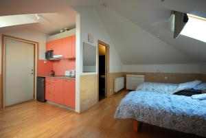 a bedroom with red cabinets and a blue bed at Piibutopsu Holiday House in Nasva