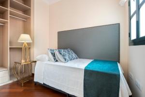 Posteľ alebo postele v izbe v ubytovaní Genteel Home Zaragoza