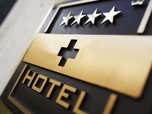 a close up of a hite sign with stars on it at Parkhotel Zug in Zug