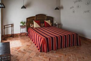 A bed or beds in a room at Prime Alture Wine Resort