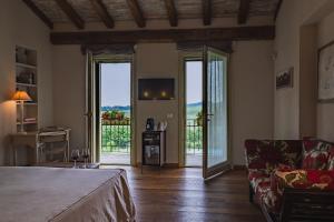 A bed or beds in a room at Prime Alture Wine Resort