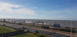 a highway next to the ocean with the ocean at Carousel Hotel in Blackpool