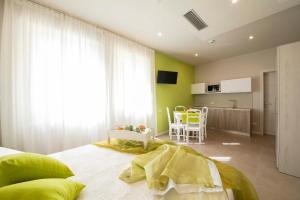 TV a/nebo společenská místnost v ubytování Apart-Hotel la Rocchetta
