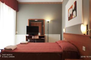 Кровать или кровати в номере Hotel Minerva